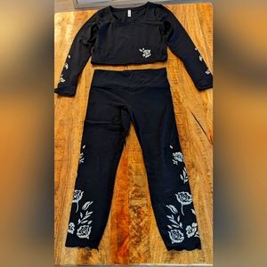 Athleta, women's black/silver, eyelet cutout crop top and legging set. Size M